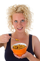 Image showing Young woman eating cornflakes