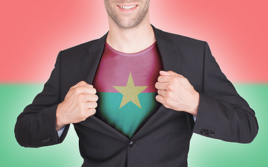 Image showing Businessman opening suit to reveal shirt with flag