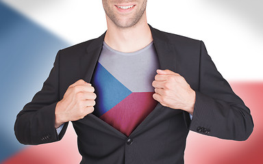 Image showing Businessman opening suit to reveal shirt with flag