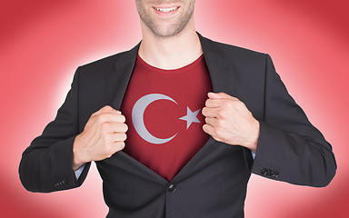 Image showing Businessman opening suit to reveal shirt with flag