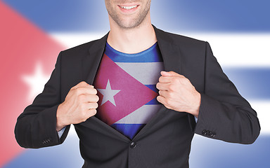 Image showing Businessman opening suit to reveal shirt with flag