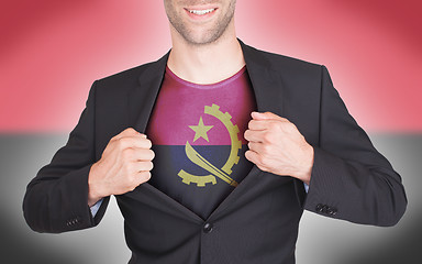 Image showing Businessman opening suit to reveal shirt with flag