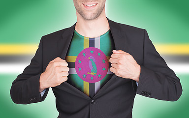 Image showing Businessman opening suit to reveal shirt with flag