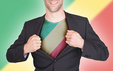 Image showing Businessman opening suit to reveal shirt with flag