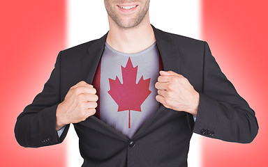 Image showing Businessman opening suit to reveal shirt with flag