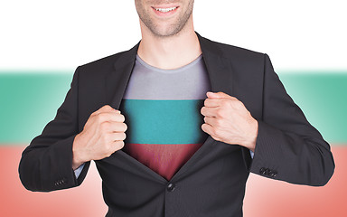 Image showing Businessman opening suit to reveal shirt with flag