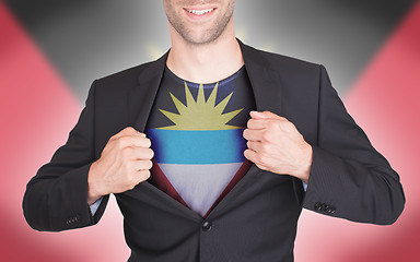 Image showing Businessman opening suit to reveal shirt with flag