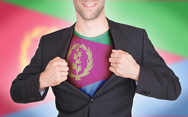 Image showing Businessman opening suit to reveal shirt with flag