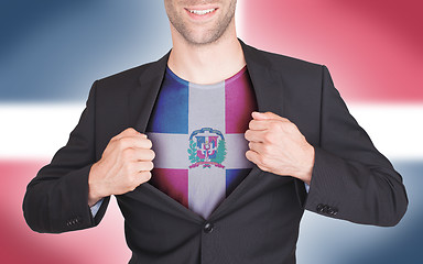 Image showing Businessman opening suit to reveal shirt with flag