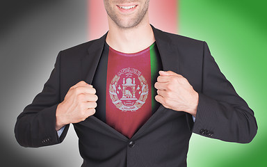 Image showing Businessman opening suit to reveal shirt with flag