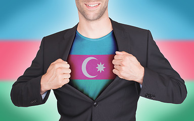 Image showing Businessman opening suit to reveal shirt with flag