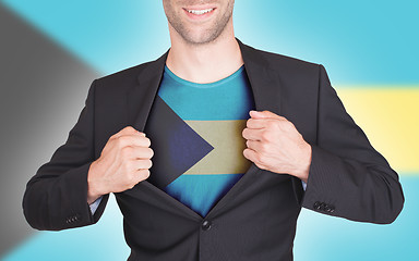 Image showing Businessman opening suit to reveal shirt with flag