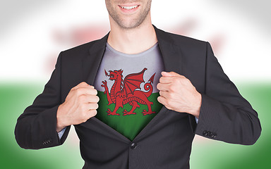 Image showing Businessman opening suit to reveal shirt with flag