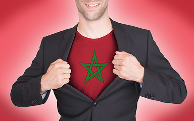 Image showing Businessman opening suit to reveal shirt with flag