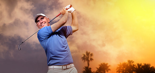 Image showing golfer shooting a golf ball