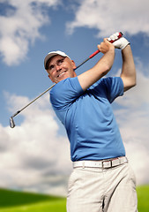 Image showing 	golfer shooting a golf ball