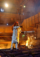 Image showing worker with hot steel