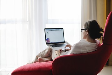 Image showing woman using a laptop computer at home