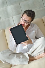 Image showing woman using tablet pc at home