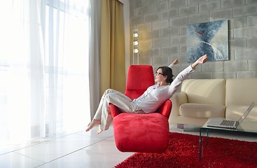 Image showing happy young woman relax at home on sofa