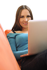 Image showing woman using a laptop computer at home