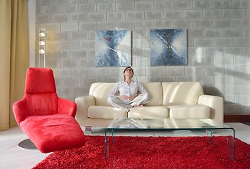 Image showing happy young woman relax at home on sofa