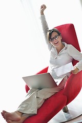 Image showing woman using a laptop computer at home