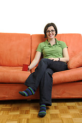 Image showing young woman eat popcorn and watching tv