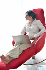 Image showing woman using a laptop computer at home