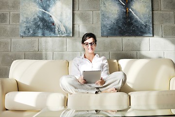 Image showing woman using tablet pc at home