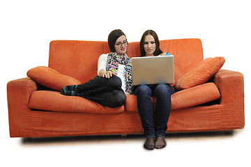 Image showing female friends working on laptop computer at home