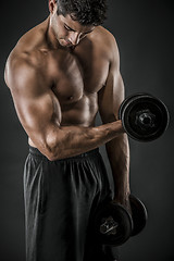 Image showing Muscular man lifting weights