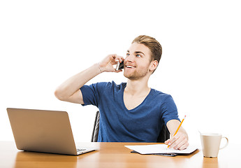 Image showing Young man and talking at phone