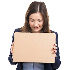 Image showing Business woman holding a cardboard