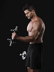 Image showing Muscular man lifting weights