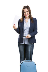 Image showing Business woman carrying a suitcase