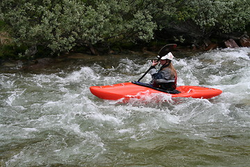 Image showing Woman doing river rafting