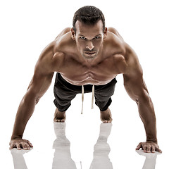 Image showing Muscle man making pushups