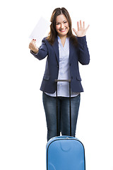 Image showing Business woman carrying a suitcase