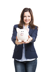 Image showing Business woman showing a piggy bank