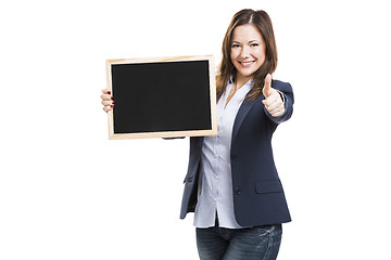 Image showing Business woman holding a chalkboard