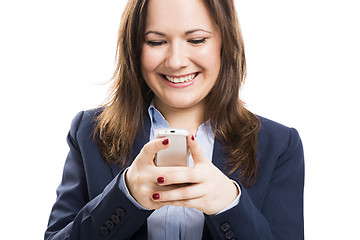 Image showing Business woman with a cellphone texting