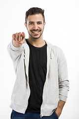 Image showing Successful latin man pointing