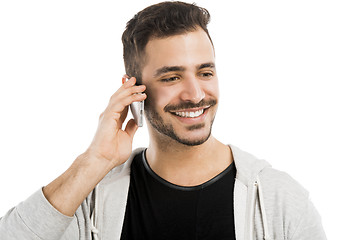 Image showing Young man talking on cell phone