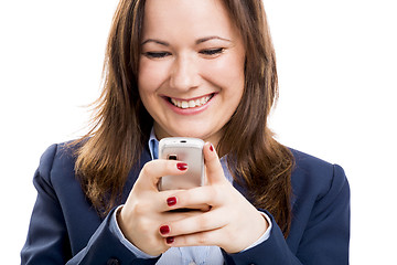 Image showing Business woman with a cellphone texting