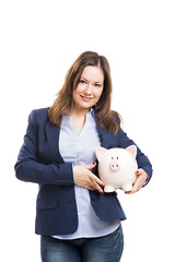 Image showing Business woman with a piggy bank