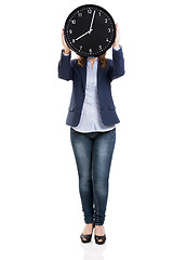 Image showing Business woman holding a big clock