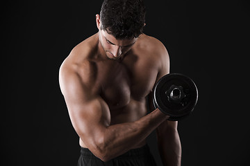 Image showing Muscular man lifting weights