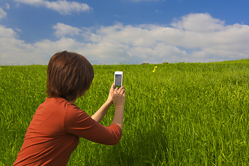 Image showing Taking pictures with a cellphone