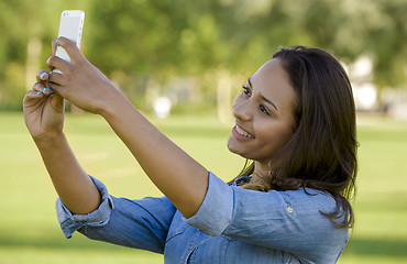 Image showing Beautiful woman taking a photo